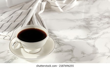 A Cup Of Coffee On A Marble Table In The Kitchen And A Vacant Seat