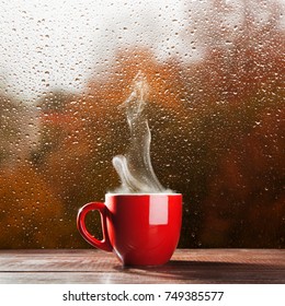 Cup of coffee on a rainy day - Shutterstock ID 749385577