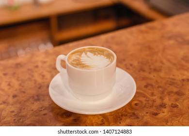 
a cup of coffee is on the table