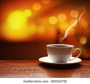 Cup Of Coffee On Table On Blured Cafe Background