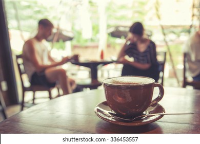 Cup Of Coffee On Table In Cafe With People Retro Instagram Effect - Shallow Depth Of Field