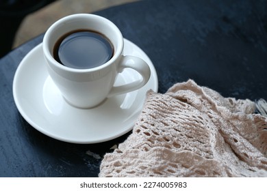 A cup of coffee on table. Selective focus