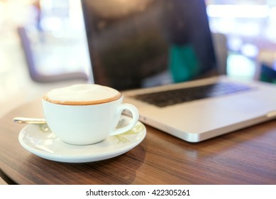 cup of coffee on table in coffee shop cafe - Shutterstock ID 422305261