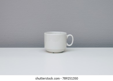 Cup Of Coffee On White Tabletop. Minimal Concept