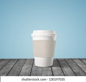 cup of coffee on wood table