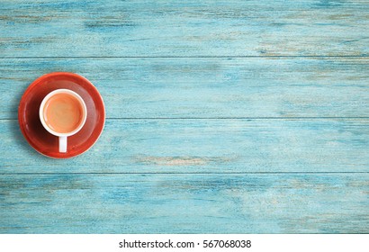 Cup Of Coffee On A Wood Table Background. Top View With Copy Space