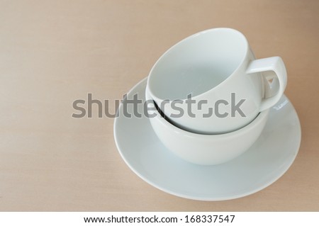 Cup of coffee on wooden board