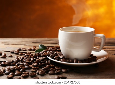 Cup of coffee on wooden table - Shutterstock ID 254727538
