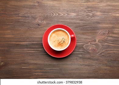 Cup of coffee on wooden table, top view - Powered by Shutterstock