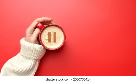 A cup of coffee and a pause icon. A break from work, a little rest - Shutterstock ID 2080738414