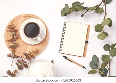 Cup coffee, pencil, branch with leaf, paper note on white - Powered by Shutterstock