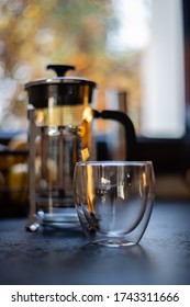 Cup Of Coffee And Pressure Coffee Maker On A Kitchen Table