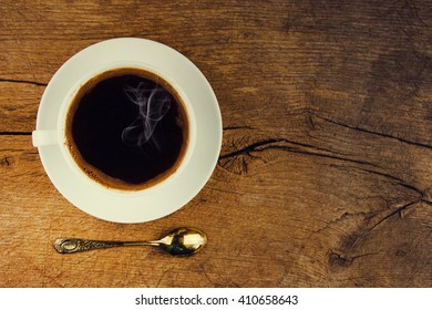 Cup of a coffee with retro filter effect.