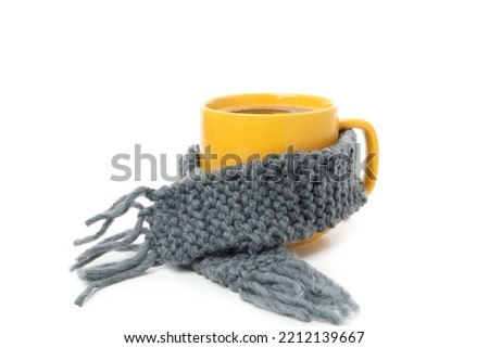 Cup of coffee with scarf isolated on white background