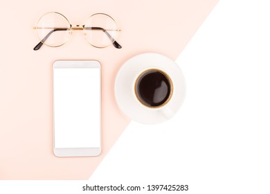 A Cup Of Coffee, Smartphone And Eye Glasses. Freelance, Business Concept. Flat Lay, Top View. Copy Space For Your Text.