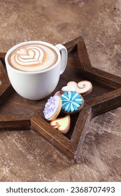 A cup of coffee and some sugar biscuits - Shutterstock ID 2368707493