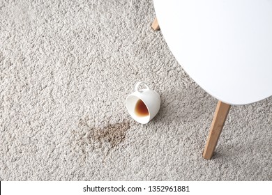 Cup of coffee spilled on carpet