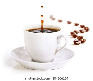 A cup of coffee with a splash of drops in the morning and coffee beans draw a zigzag line in background.