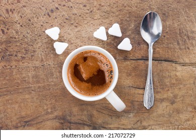 Cup Of Coffee With Sugar Cubes In Shape Of Heart From Above