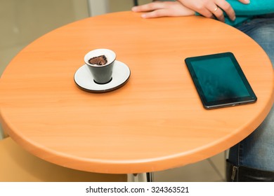 cup of coffee and a tablet