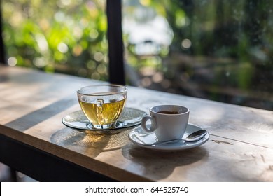 A Cup Of Coffee And Tea On Wooden Table