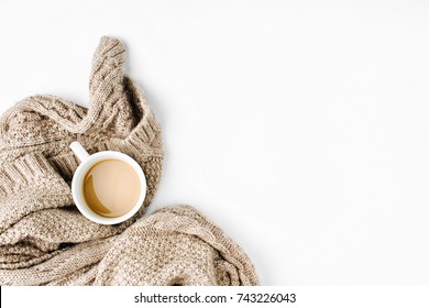 Cup of coffee  with warm plaid. Copy space. Flat lay, top view
