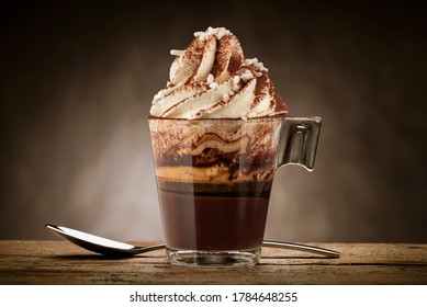 Cup Of Coffee With Whipped Cream, Milk Foam, Sugar And Cocoa Powder.