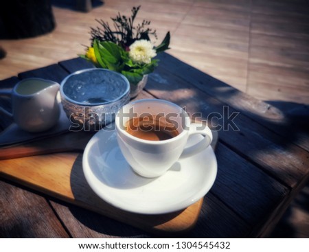 Cup and​ coffy on​ the table, flat lay