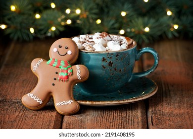 Cup of creamy hot chocolate with melted marshmallows and gingerbread cookies  for christmas holiday