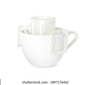Cup with drip coffee bag isolated on white