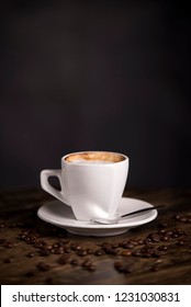 Cup Of Espresso Caffee Isolated On Wooden Table With Caffee Beans. Time For Caffee.