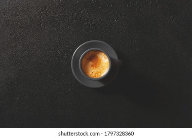 The Cup Of Espresso Coffee On Black Table, Overhead View