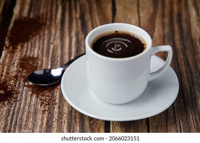 Cup of espresso coffee on wooden table