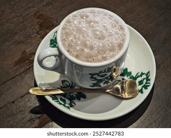 A cup of foamy hot chocolate  - Powered by Shutterstock