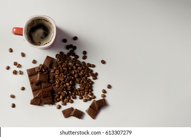 cup of fragrant coffee, beans coffee and chocolate on white background. copy space.
