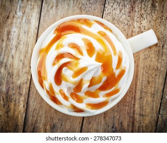 Cup Of A Fresh Caramel Latte With Whipped Cream, Top View