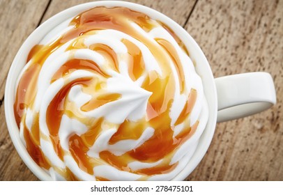 Cup Of A Fresh Caramel Latte With Whipped Cream, Top View