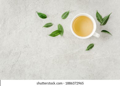 Cup Of Fresh Green Tea With Tea Leaves. Flat Lay, Top View. Tea Concept