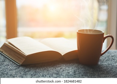 Cup Of Fresh Tea Or Morning Coffee And Open Book At Home At Morning Light, Reading Book And Drinking Coffee Concept