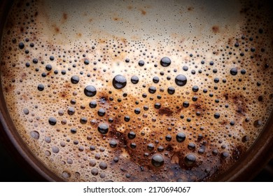 Cup Of Freshly Brewed Coffee With Foam Close Up