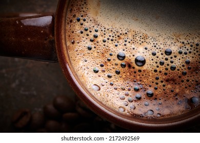 Cup Of Freshly Brewed Coffee With Foam Close Up