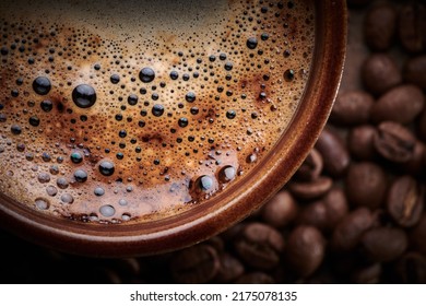 Cup Of Freshly Brewed Coffee With Foam Close Up