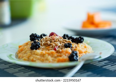 Cup Of Freshly Brewed Pumpkin Porridge With Berries. Healthy Food Idea