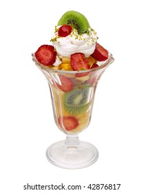 Cup of fruit salad with maraschino cherry isolated on white bacground
