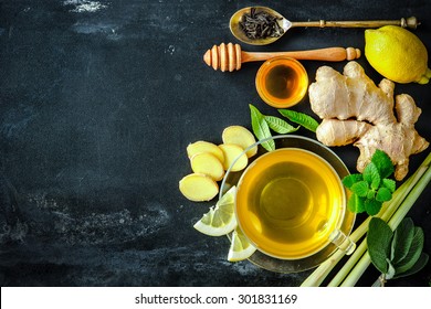 Cup Of Ginger Tea With Lemon And Honey On Slate Plate