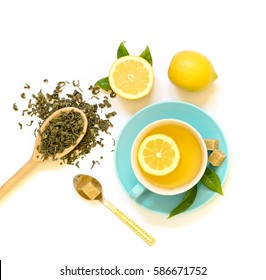 Cup Of Green Tea With Lemon And Ingredients Isolated On White Background. View From Above.