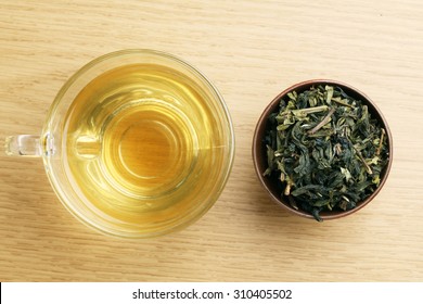 Cup With Green Tea On Wooden Background.View From The Top.