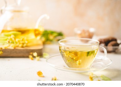 Cup of herbal tea with linden flowers on white background - Shutterstock ID 2070440870