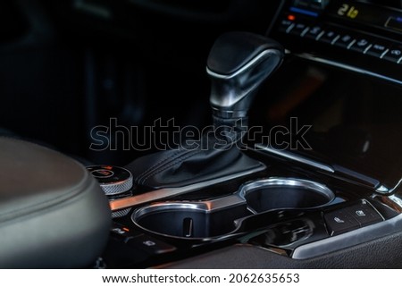 Cup holders inside modern car interior. Interior view of modern car.