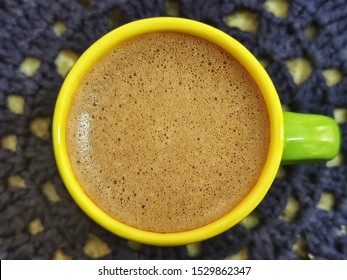 Cup Of Homemade Cappuccino Top Down View With Blue Lace Under It